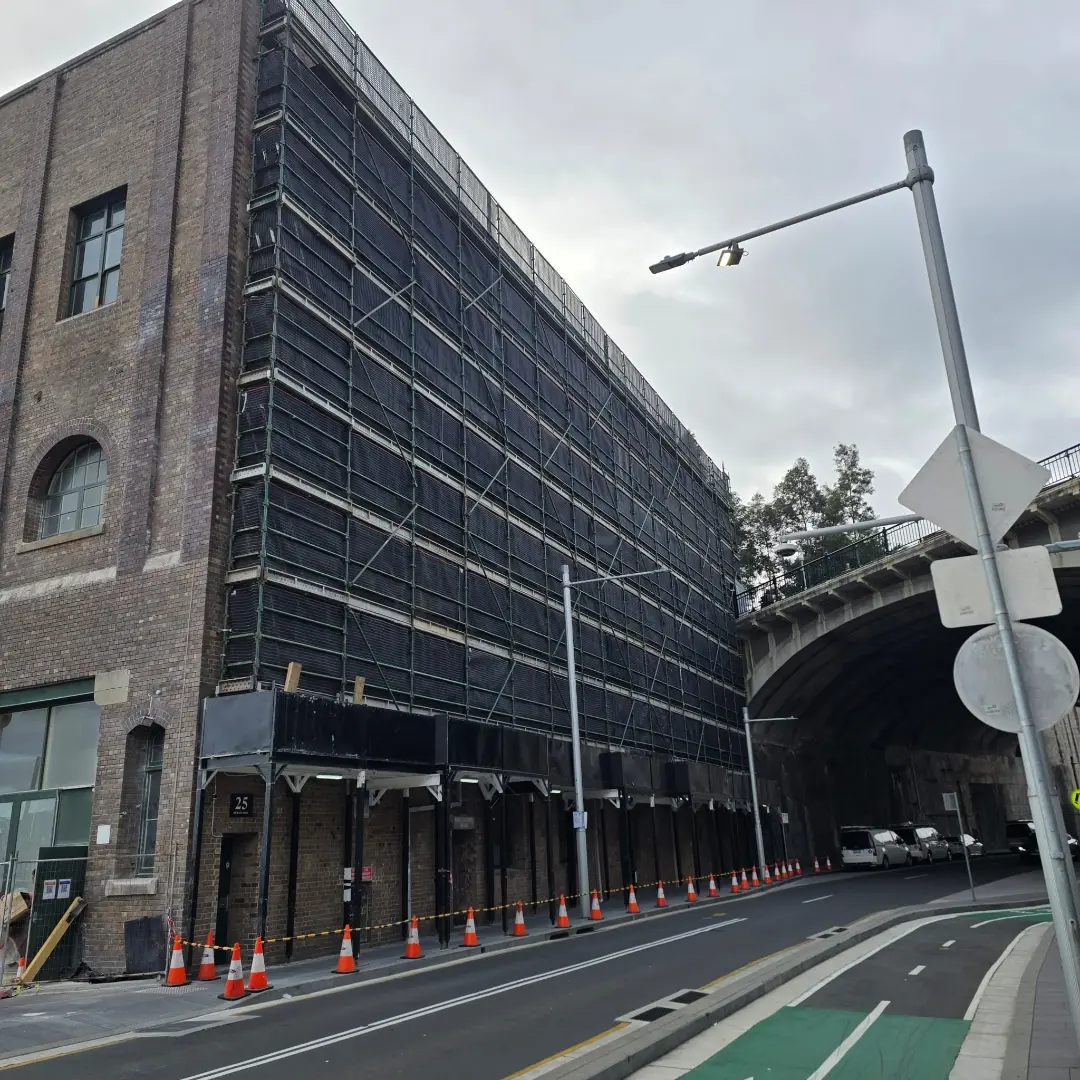Site hoarding for a facade restoration project at 52 Hickson Street, Barangaroo