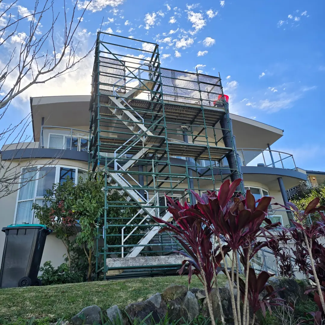 Waste chute in use on a residential roof repair project