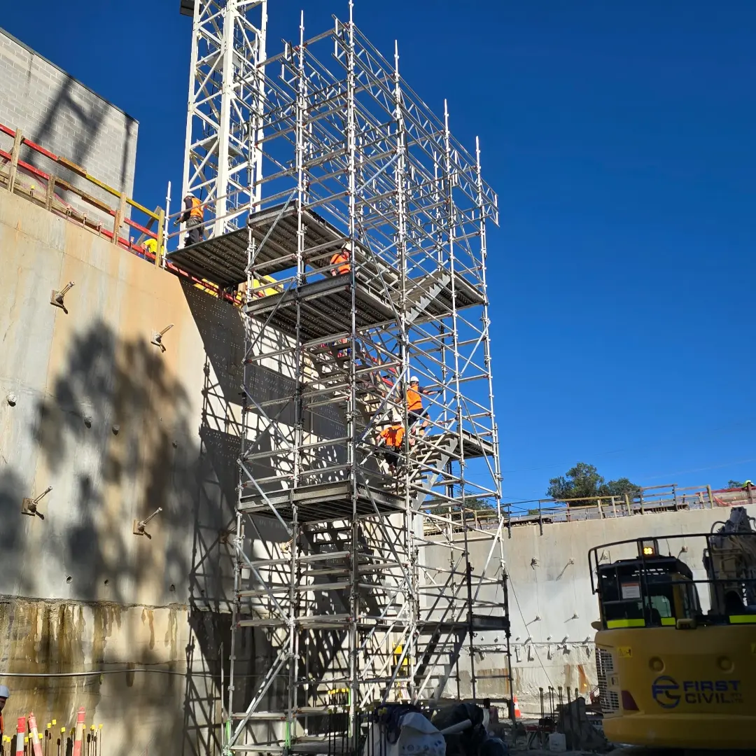 Mortlake, NSW — "Engineered For Efficiency. Built For Productivity." · Crane-lift aluminium stair tower