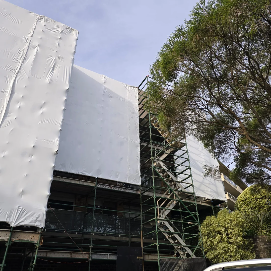Mosman, NSW — Shrink Wrap Encapsulation — Rain doesn't stop the job unless you let it. · Shrink wrap encapsulation & temporary roof system