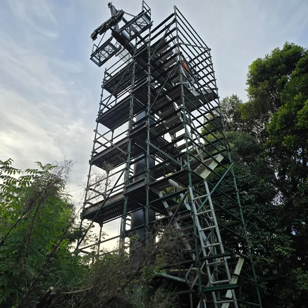 Engineered scaffold design drawings alongside a custom scaffold installation